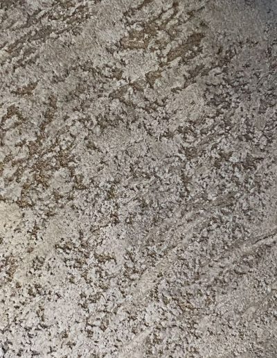 Close-up of weathered silver metal with brown rust patches, rough industrial texture, and light reflections.